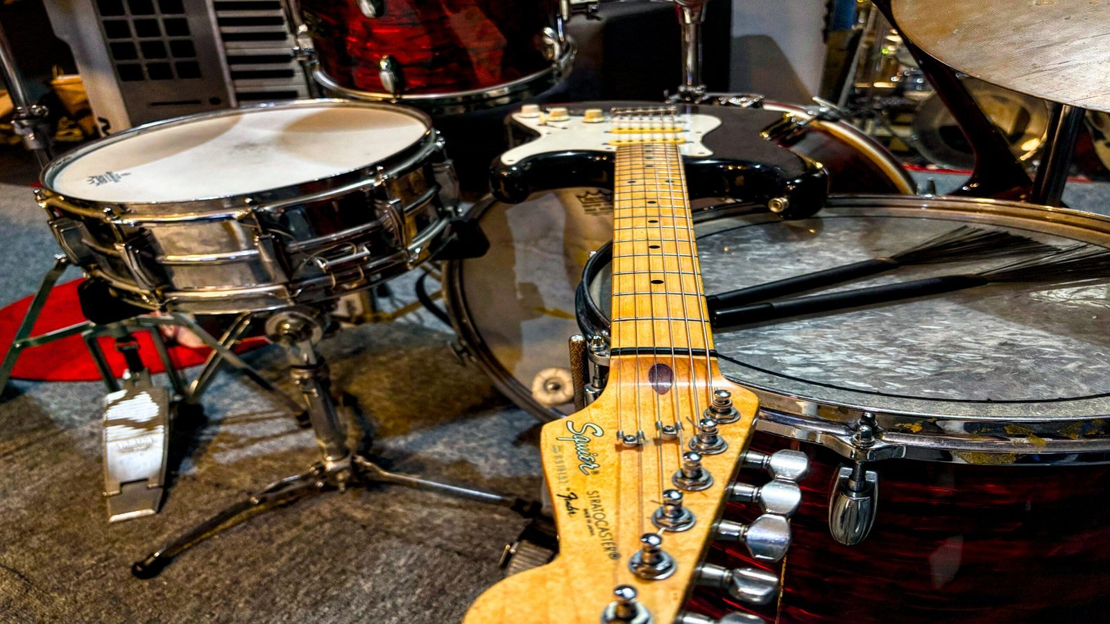 Guitar and drums in a music performance setting